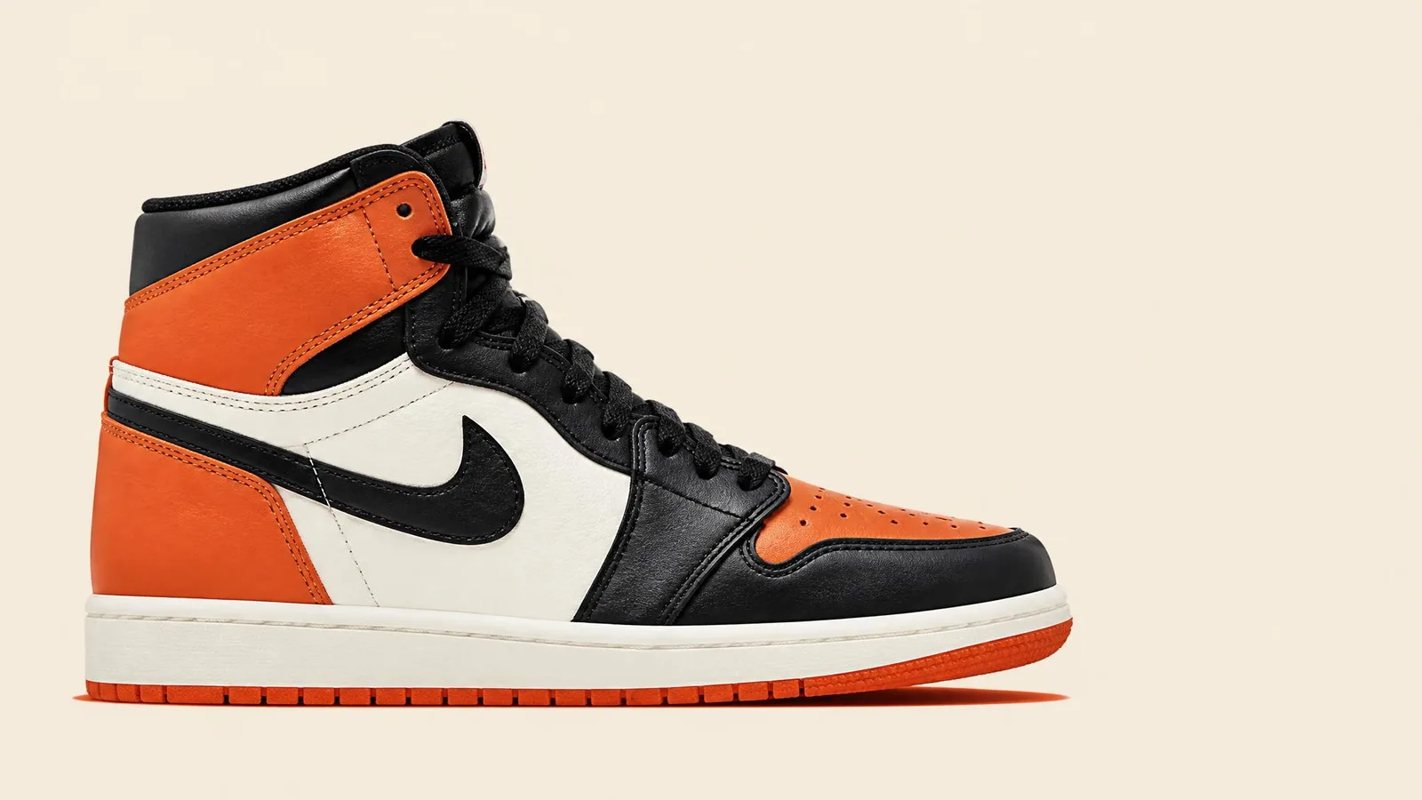 A single limited-edition high-top sneaker photographed in clean catalogue style against a warm off-white background, side profile showing full silhouette and sole detail.