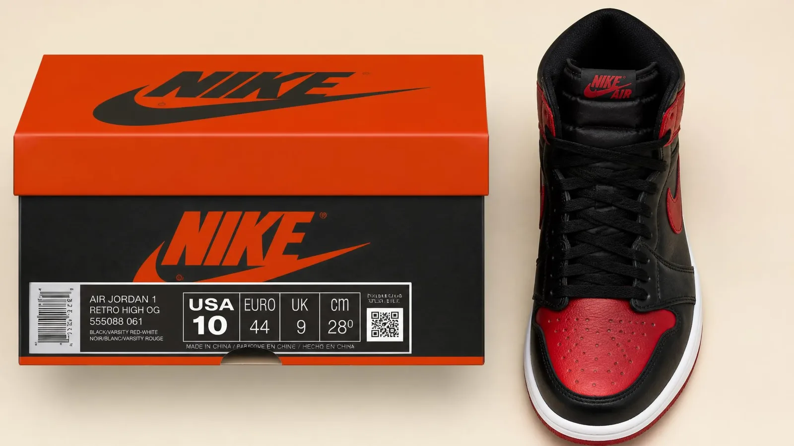 An Air Jordan sneaker placed next to its original shoebox with the box label facing forward, illustrating the information a collector needs to record when cataloguing a pair.