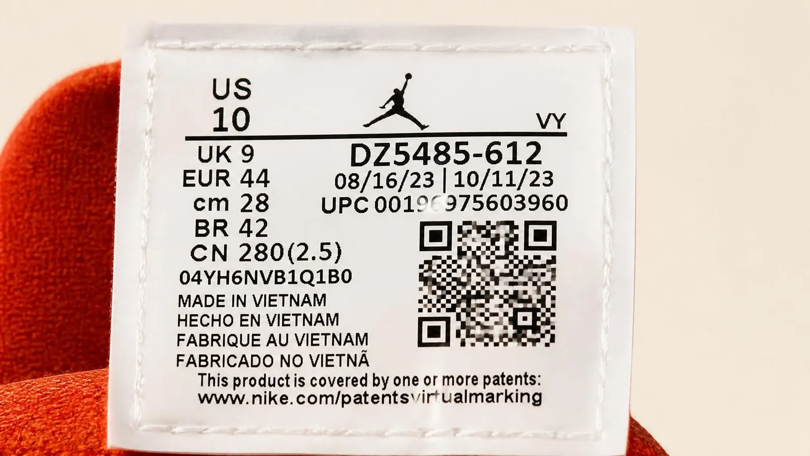 Close-up of the interior size tag inside an Air Jordan sneaker, showing the style code and size information that collectors use to create accurate catalogue records.