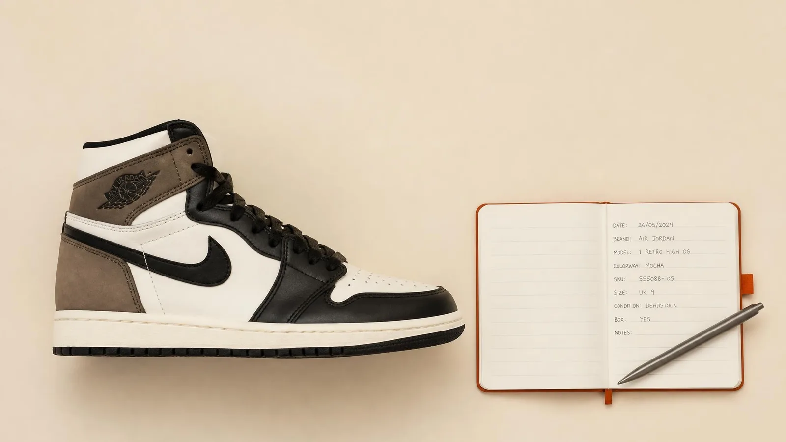 A flat-lay of an Air Jordan sneaker beside an open notebook with handwritten catalogue fields and a pen, representing a collector's structured workflow for logging each pair.