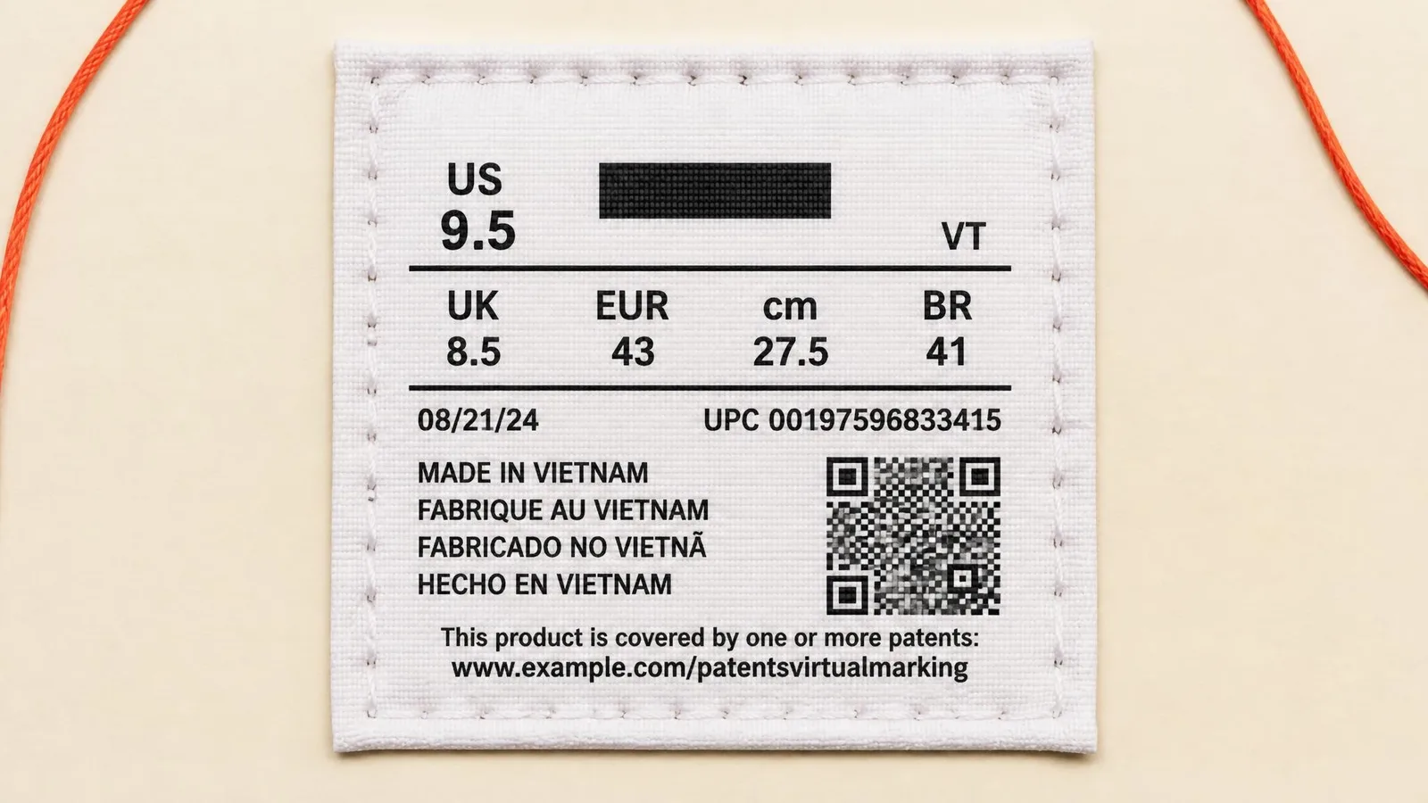 Close-up flat-lay of a sneaker tongue tag on a white surface, showing the printed country-of-origin label in sharp detail, illustrating the legal trade marking found on Nike and Jordan footwear.