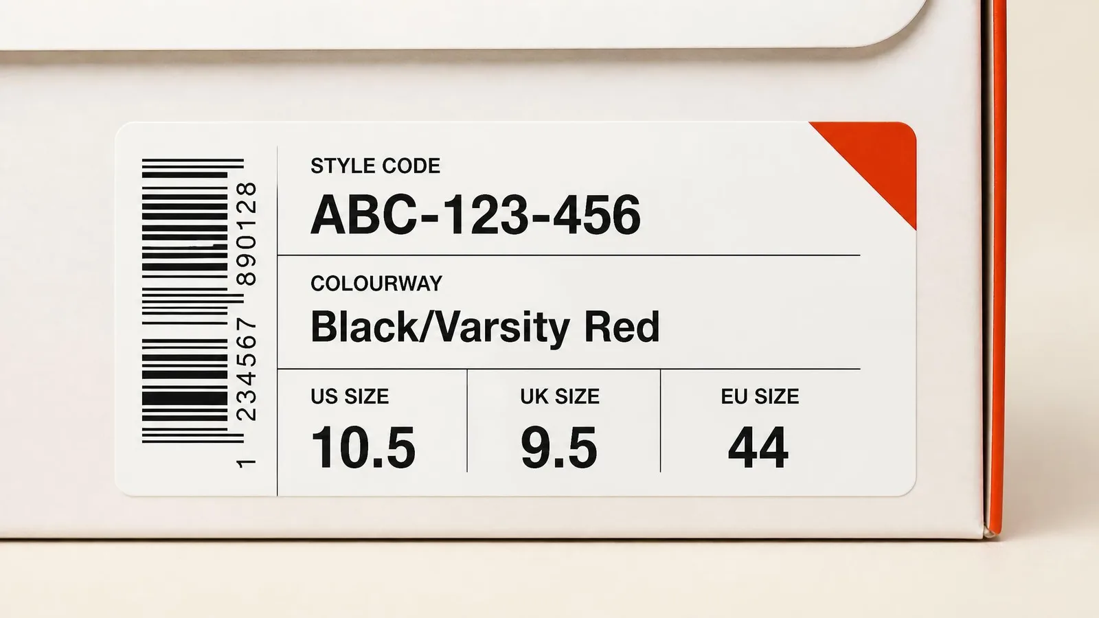 Close-up of a sneaker box label showing a style code, colourway name, and size information printed in manufacturer format, illustrating how to read and record SKU data.